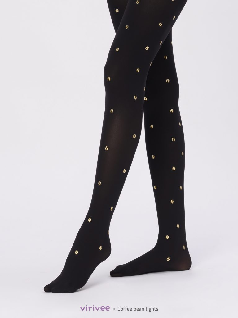 Schwarze Strumpfhose mit goldenem Kaffeebohnen-Print.